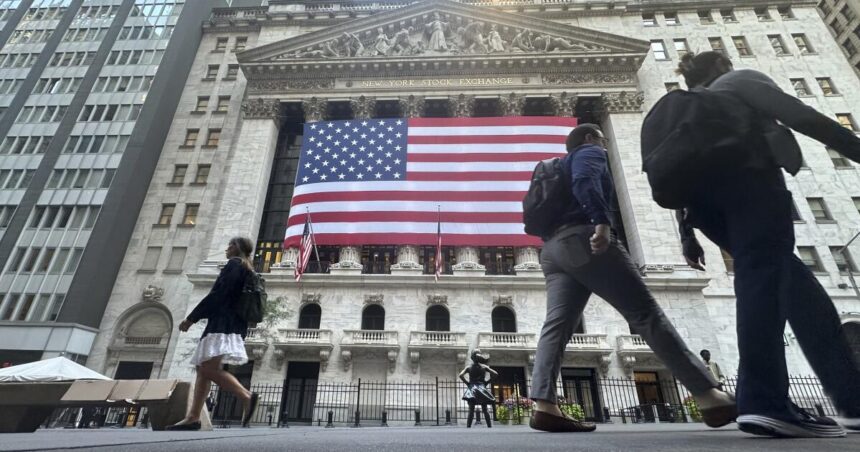 Dow hits record as Wall Street prepares for interest rate cuts